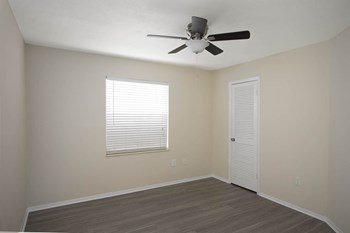 Bedroom with wooden flooring Property Image